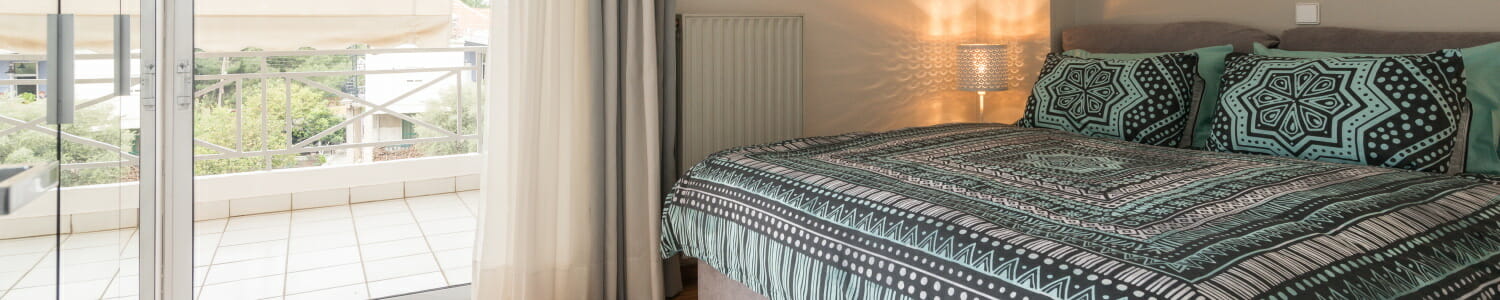 Bed Bedroom 1 in Comfy City Apartment FIL27 1500x300